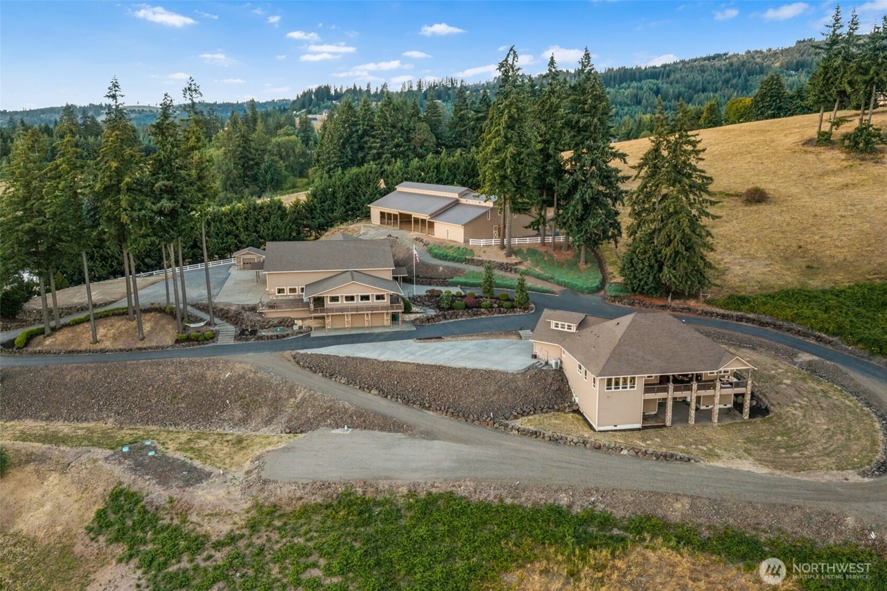 Aerial view of the 6.63-acre estate grounds and outbuildings above the Columbia River